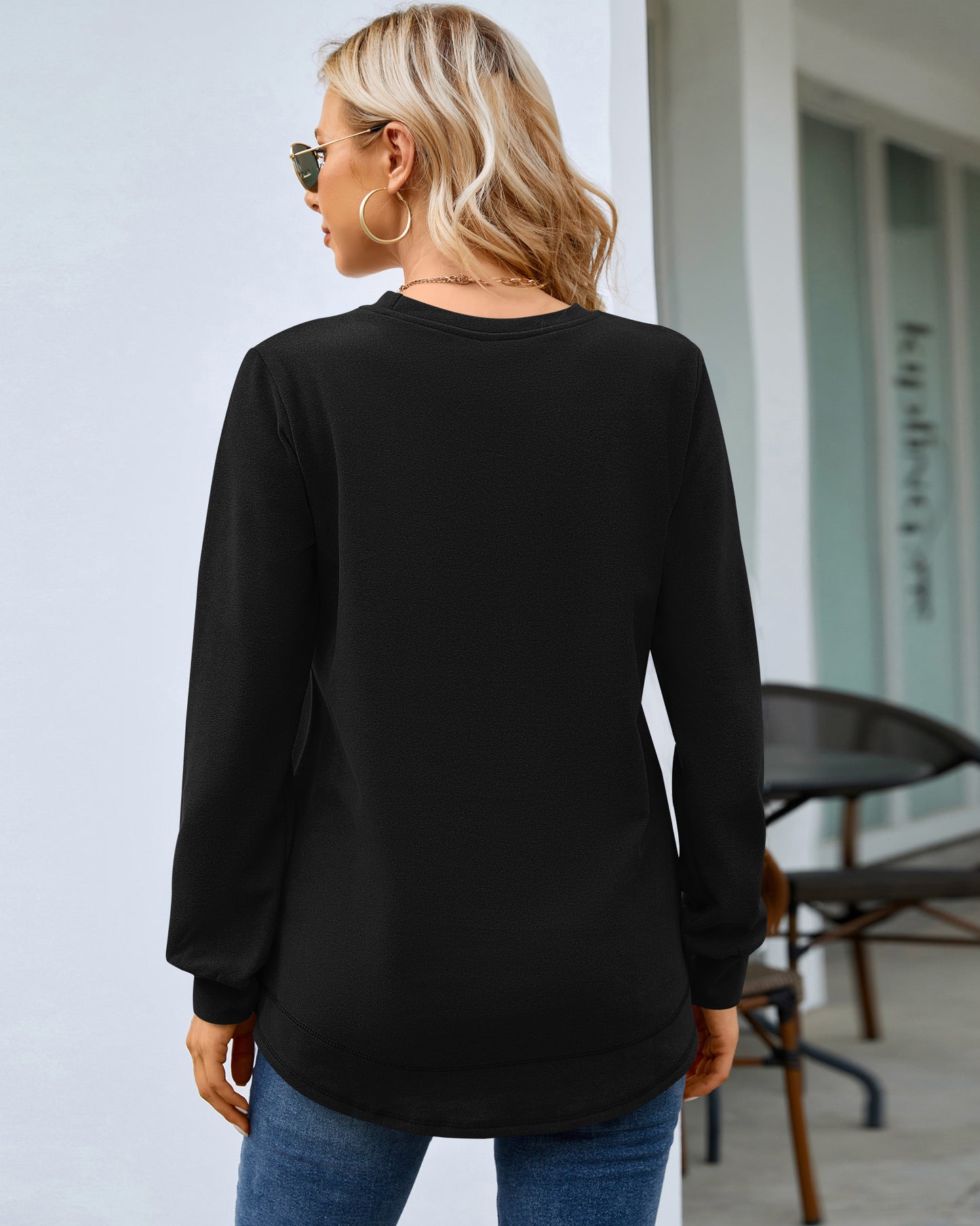Back view of AUSELILY women's black long sleeve crewneck sweatshirt